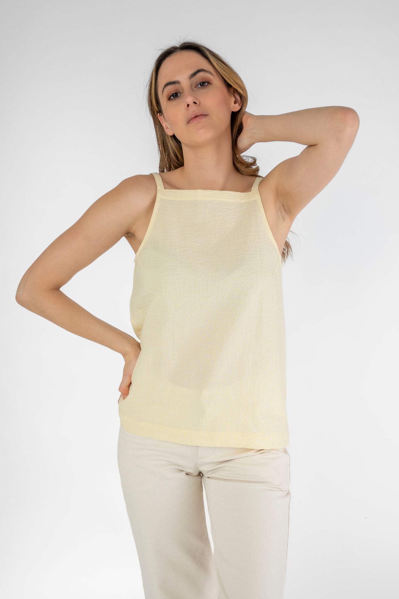 Light top with thin yellow straps
